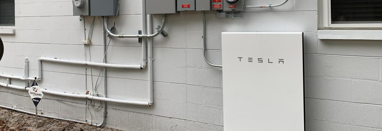 Tesla Powerwall on the outside of a house